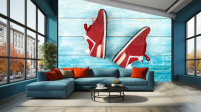 Sport shoes of red on wooden background Wall mural