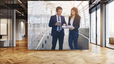 business partners team employees discussing documents and ideas during lunch break on business district , business concept Wall mural