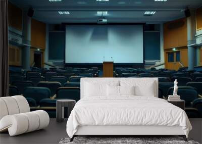 An auditorium with rows of empty seats, a podium, and a large screen for a lecture Wall mural