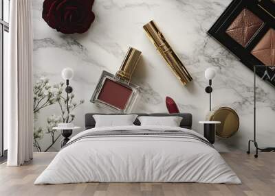 A luxurious flat-lay featuring high-end makeup products like designer perfume, gold-accented lipstick, and eyeshadow on a marble surface. Wall mural