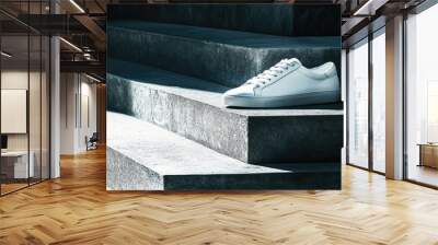 A single white leather sneaker placed on a minimalist concrete step, with soft lighting highlighting the clean design and smooth texture. Wall mural