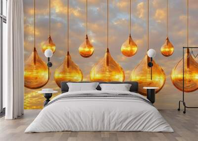 Row of vintage-style light bulbs against a sunset sky, with golden hues reflecting off the glass for a serene, glowing ambiance Wall mural