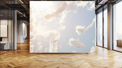 Soft, fluffy white feathers gently floating through a bright sky, creating a light and ethereal atmosphere. Wall mural