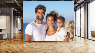 A happy family enjoying a sunny day at the beach, showcasing love and togetherness against a beautiful coastal backdrop. Wall mural