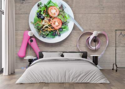 Sport equipments, fresh salad and measuring-tape in heart shape, Healthy lifestyle concept Wall mural