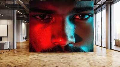 A close-up portrait of a man with dramatic lighting emphasizing facial features. Wall mural