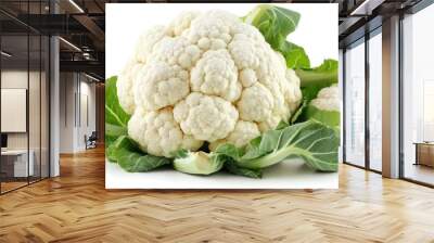 A fresh cauliflower with green leaves, showcasing its texture and natural form. Wall mural