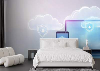 A laptop and smartphone displaying cloud security icons, emphasizing digital protection. Wall mural