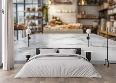 A marble table in a cozy bakery with baked goods in the background. Wall mural