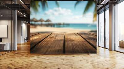 A serene beach view with a wooden table in the foreground and palm trees in the background. Wall mural