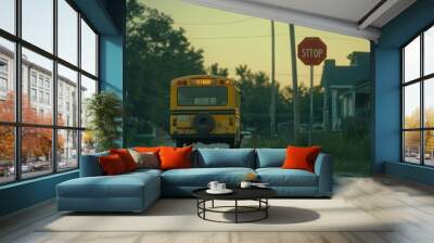 A yellow school bus drives down a quiet street, passing a stop sign and residential homes. Wall mural