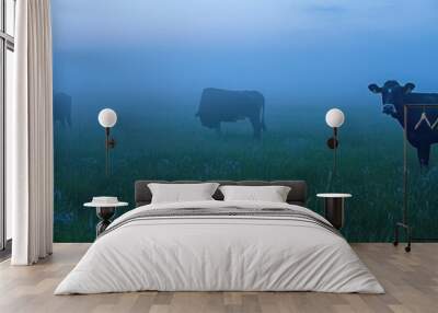 Cows in a misty field at dawn, creating a serene rural atmosphere. Wall mural