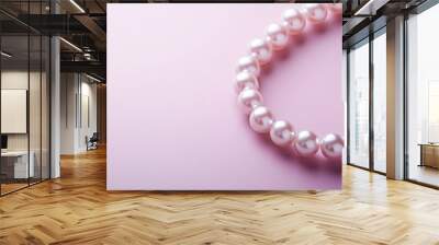 Elegant Pearl Necklace on Pink Background Wall mural