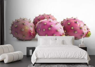 Four vibrant prickly pears on a white background, showcasing their unique texture and color. Wall mural