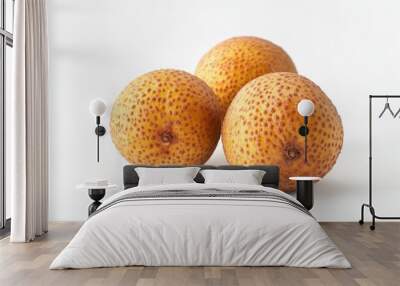 Three round, textured fruits with a yellow-brown hue arranged on a white background. Wall mural