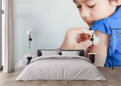 boy and vaccine syringe Wall mural