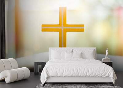 Open holy bible with yellow cross in the middle. Wall mural