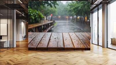 Empty wooden table top with blur raining background. Wall mural