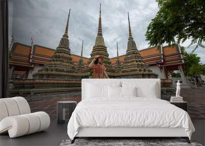 Asian women tourist traveling at Wat Po, Bangkok, Thailand, Traveler and Journey trip concept Wall mural