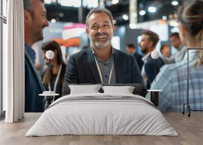 A man and two women at trade shows demonstrate products, effectively highlighting their features and benefits. Wall mural