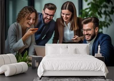 A team of professionals, both men and women in a modern office, showcasing their enthusiasm and camaraderie as they pose for a group photo while working on laptops. generative AI. Wall mural