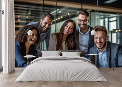 A team of professionals, both men and women in a modern office, showcasing their enthusiasm and camaraderie as they pose for a group photo while working on laptops. generative AI. Wall mural