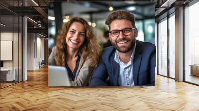 A team of professionals, both men and women in a modern office, showcasing their enthusiasm and camaraderie as they pose for a group photo while working on laptops. generative AI. Wall mural