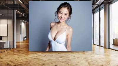 A youthful Asian model exuding beauty and confidence while wearing an appealing bikini, isolated within her personal spotlight. Generative AI. Wall mural