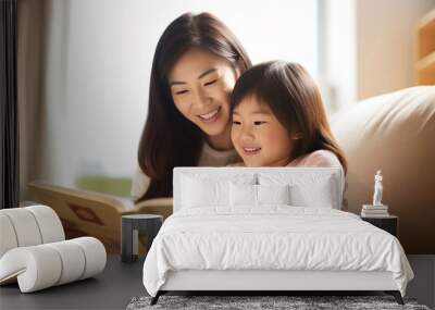 An Asian mother and daughter spend free time together by reading a book on a comfy sofa at home. Parent and family special time. Generative AI. Wall mural