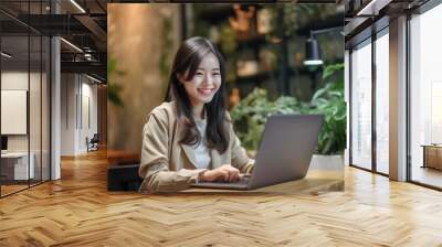 Asian woman working laptop. Business woman busy working on laptop computer at office. Generative AI. Wall mural