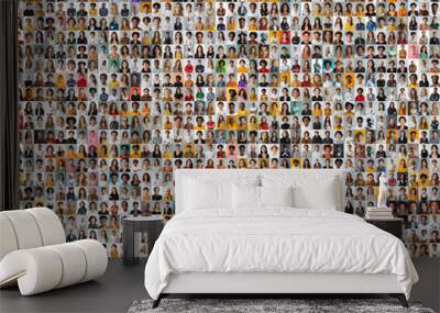 collage of headshots showcasing a diverse range of smiling women and men from various genders, ages, career and cultural backgrounds, set against a plain blackground. Wall mural