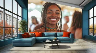 Surrounded by colorful lights, a smiling black woman in casual festival wear enjoys the energy of the night, exuding confidence and happiness. Wall mural