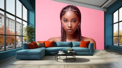 The portrait of an attractive young black female model in pink outfit  with braids hairstyle and full makeup isolated on a pink background, shot in a studio. Generative AI. Wall mural