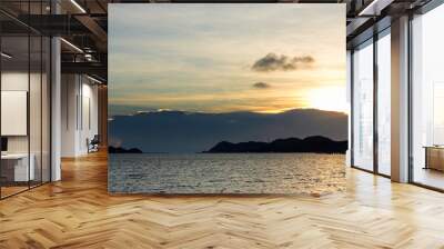 beautiful seascape, golden sunset behind island and above the sea at asia Wall mural