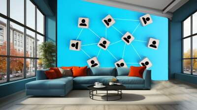 Wooden blocks connected together social network  on blue background. Teamwork, network and community concept.                      Wall mural