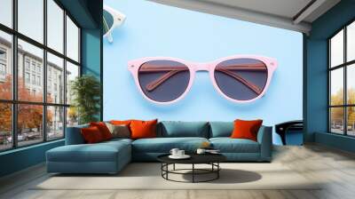 Pink Sunglasses with a Blue Background. Wall mural