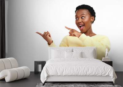 PNG shot of a young woman pointing at copy-space while posing. Wall mural