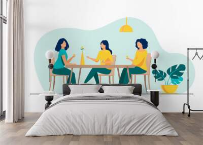 Three female friends sitting in cafe at lunch and talking flat vector illustration. Women hanging out together. Friendship and communication concept. Wall mural