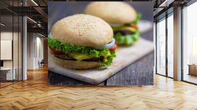 Homemade hamburgers on wooden board Wall mural