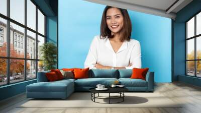 portrait business woman asian on blue background Wall mural