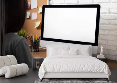 woman working empty screen computer on wood desk in home office. Wall mural