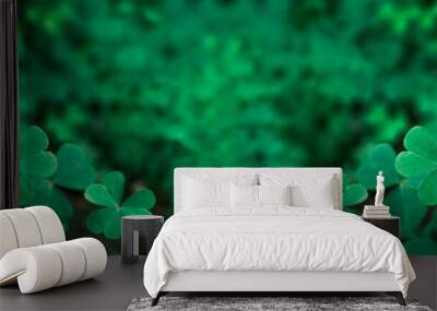 Green background with three-leaved shamrocks, Lucky Irish Four Leaf Clover in the Field for St. Patricks Day holiday symbol. with three-leaved shamrocks, St. Patrick's day holiday symbol, earth day. Wall mural