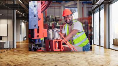 American worker working in factory,African american black man are operator control machine factory industrial Wall mural