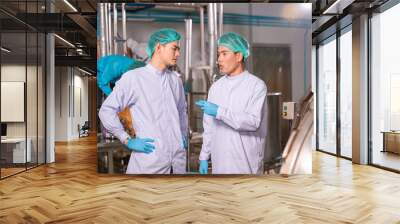 Asian  man employee working in food Factory industry Wall mural