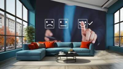 Businessman giving rating with happy icon, Customer satisfaction survey concept Wall mural