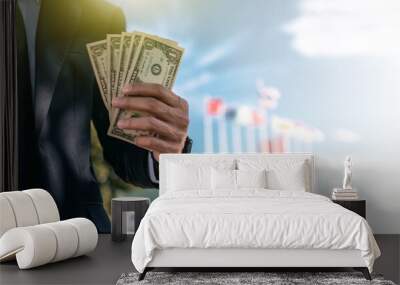 Businessman holding dollar money business investment concept Wall mural