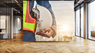 Businessman holding hard hat building estate construction background,Engineer Supervisor  Foreman concept Wall mural