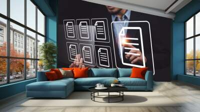 businessman reviews the steps using a virtual online document and paperwork. Wall mural