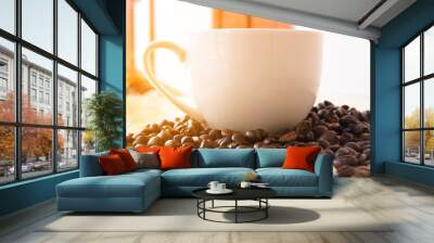 Coffee in white cup on wooden table in coffee shop Wall mural