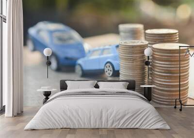 Coins stack and car model on wood table concept Business car insurance investment rent seller buy finance Wall mural